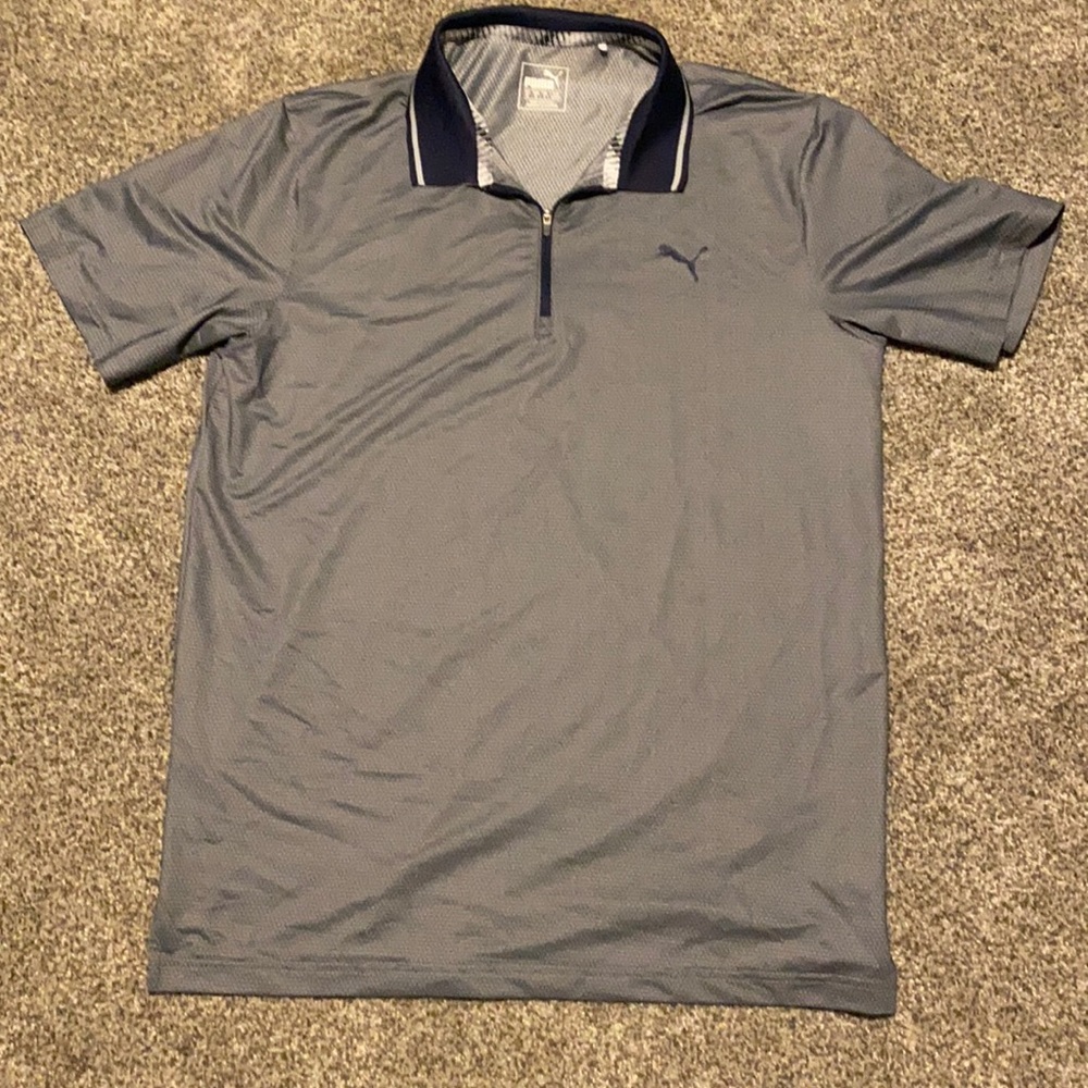 Men’s medium navy blue Puma golf shirt.